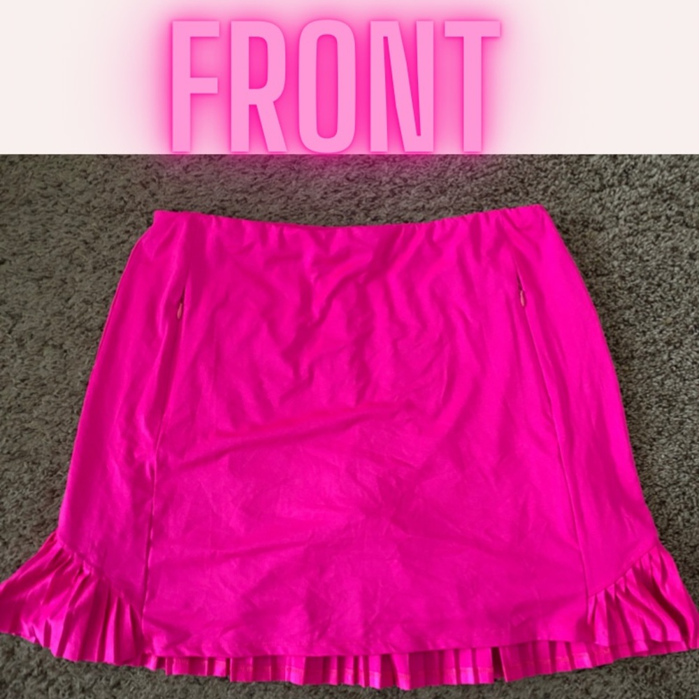 Pink pleated golf skort